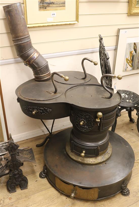 A Dutch barge wood turning stove W.68cm